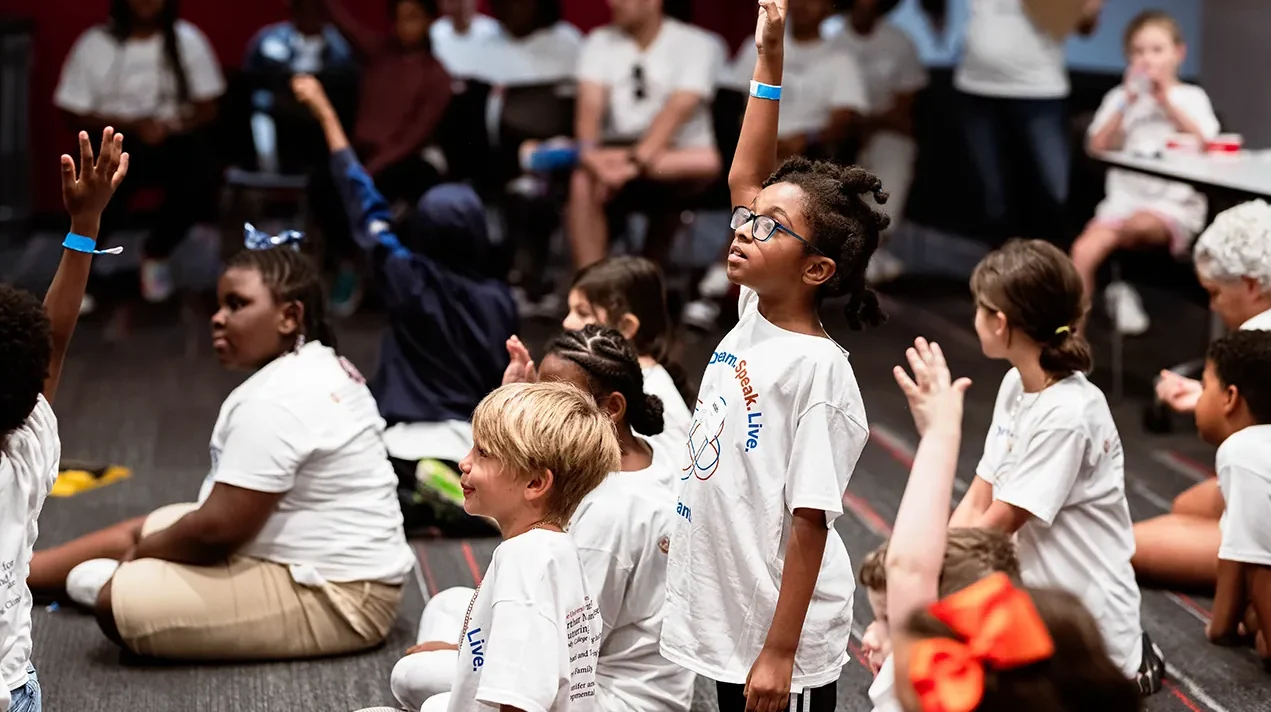 girl raises her hand